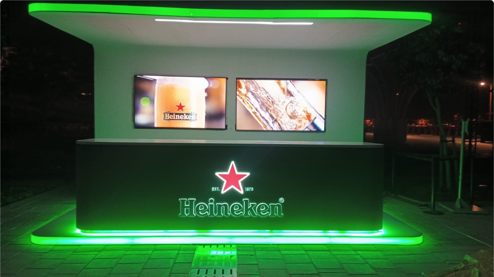 Heineken branded island bar installed at an outdoor activation