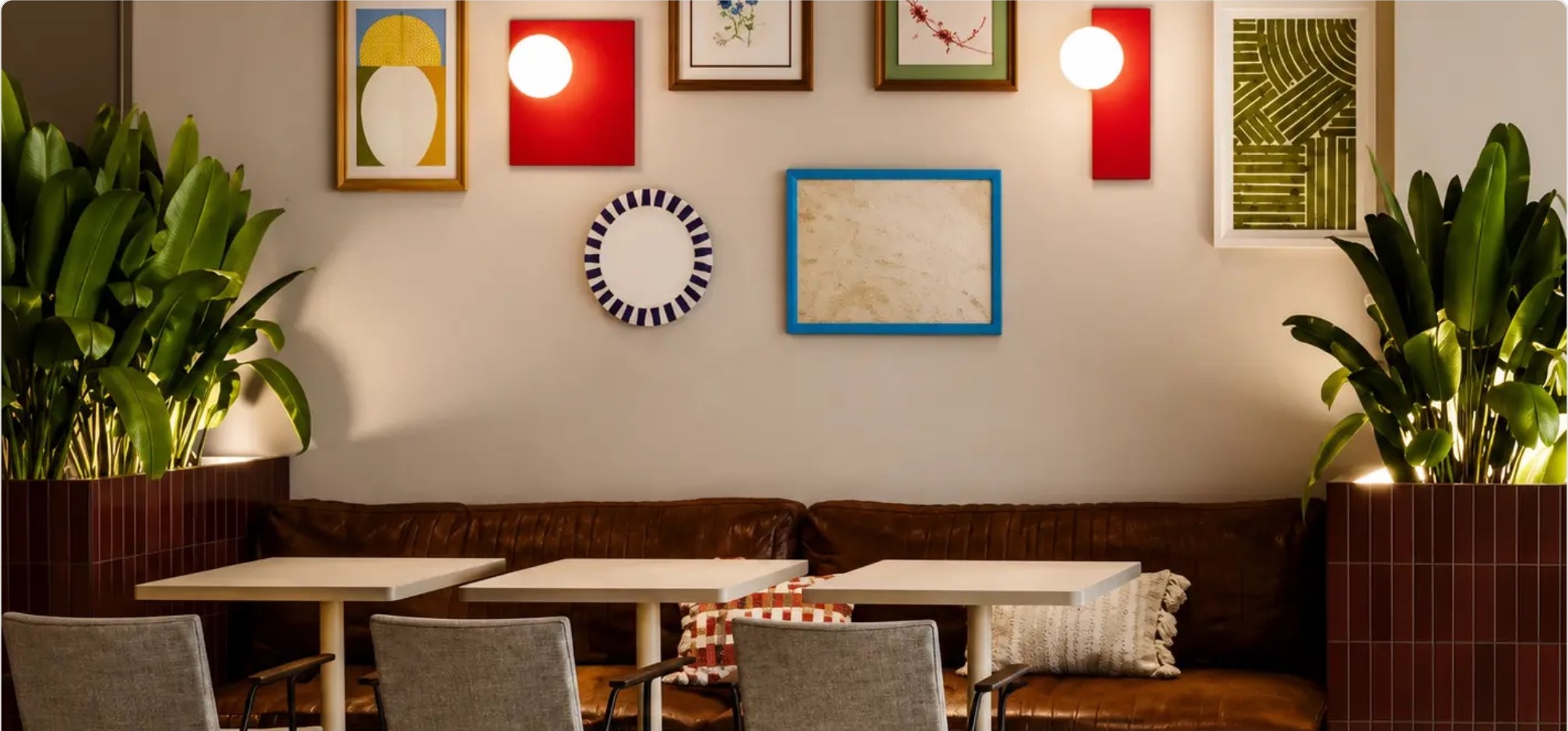 Banquette seating and gallery-style printed art wall