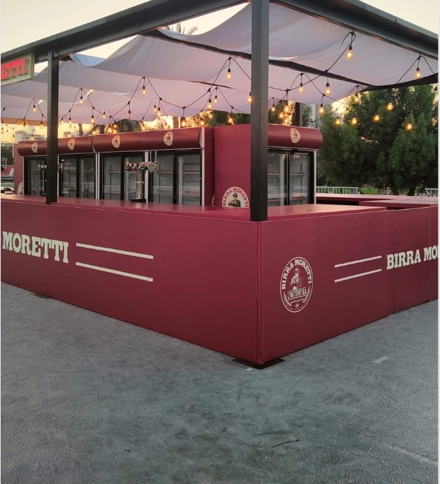 Burgundy island bar with printed brand graphics