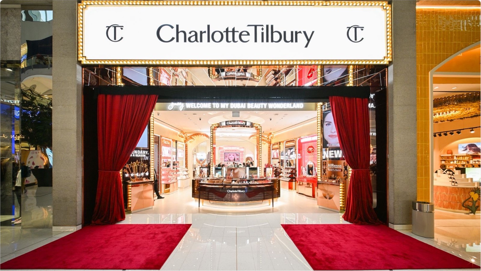 Illuminated marquee storefront and portal joinery at Charlotte Tilbury Dubai